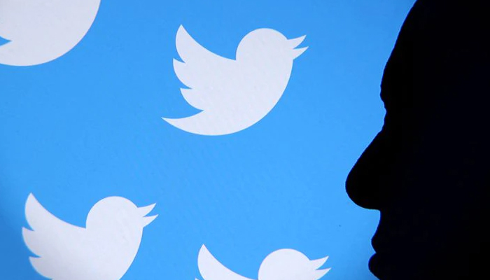 Elon Musk photo and Twitter logo are seen through magnifier in this illustration taken November 4, 2022. — Reuters