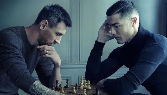 Footballers Lionel Messi (L) and Cristiano Ronaldo. — Twitter