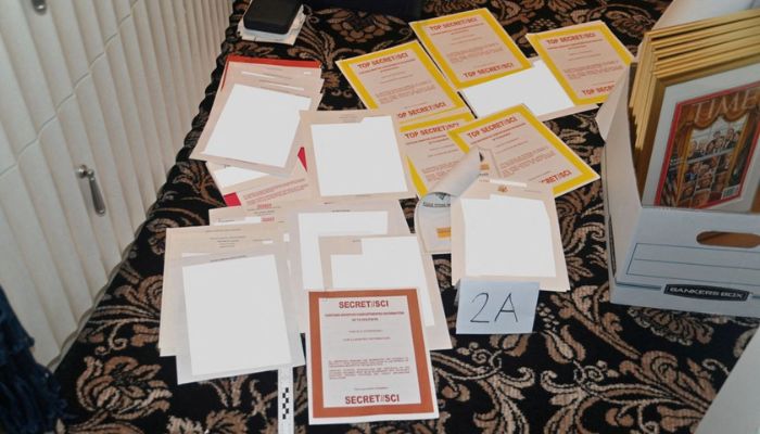 A redacted FBI photograph of documents and classified cover sheets recovered from a container stored in former U.S. president Donald Trumps Florida estate, and which was included in a U.S. Department of Justice filing and released August 30, 2022.— Reuters