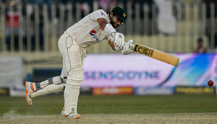 Pakistans Imam-ul-Haq plays a shot during the fourth day of the first cricket Test match between Pakistan and England at the Rawalpindi Cricket Stadium, in Rawalpindi on December 4, 2022. — AFP