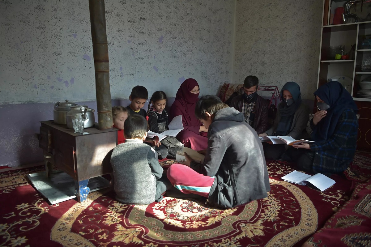 With her dream of university ended, Marwa (2nd R) will now stay home to teach her six younger siblings.— AFP