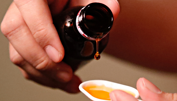 A cough medication is poured in this picture illustration taken October 19, 2022. — Reuters