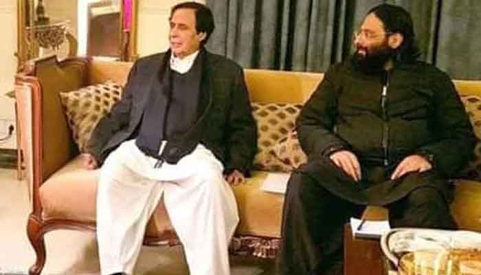 Chief Minister Punjab Parvez Elahi with his son Rasikh Elahi. -Screengrab/Geo News