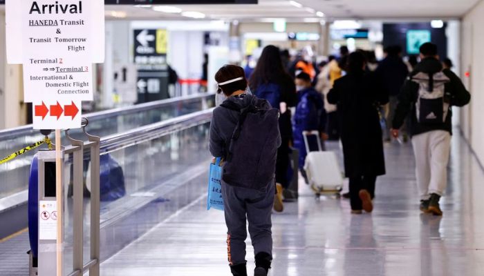 Passengers of a plane from Dalian in China, head to the coronavirus disease (COVID-19) test area, upon their arrival at Narita international airport in Narita, east of Tokyo, Japan January 12, 2023.— Reuters