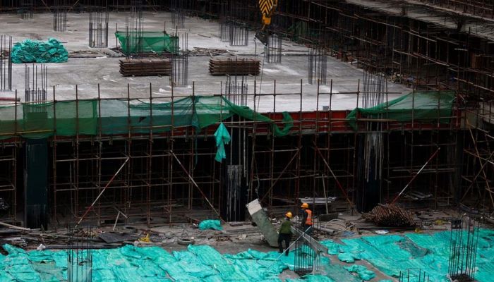 Workers work at a construction site in Beijing, China January 12, 2023.— Reuters