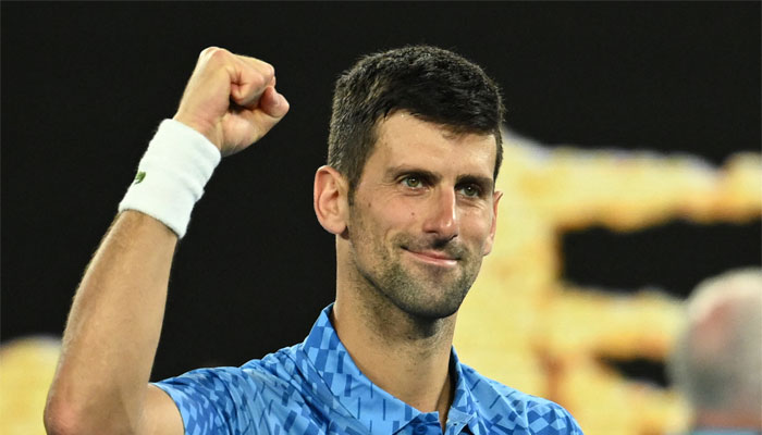 Serbias Novak Djokovic celebrates after victory against Australias Alex De Minaur during their mens singles match on day 8 of Australian Open tennis tournament in Melbourne on January 23, 2023. — AFP