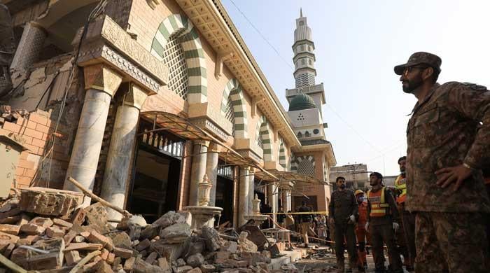 Distraught families look for loved ones as mosque blast toll reaches 100