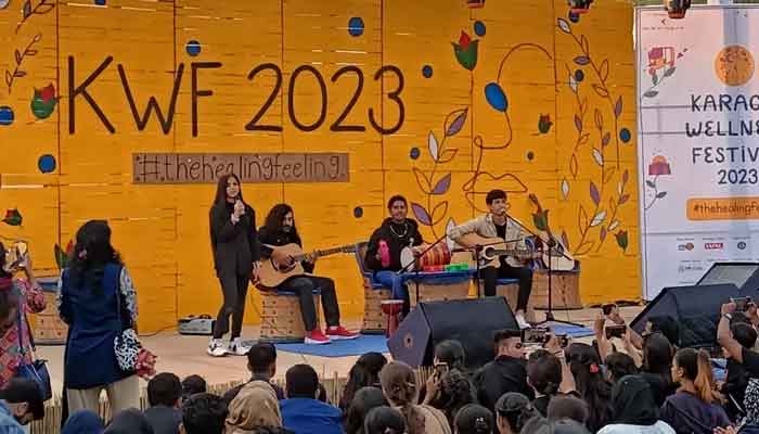 An attendee singing at the live show at the Karachi Wellness Festival held at Veritas Learning Circle in PECHS on February 04, 2023. &mdash; Provided by the author