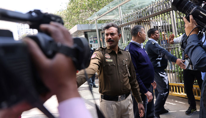 Police officers stand outside a building having BBC offices, where income tax officials are conducting a search, in New Delhi, India, February 14, 2023. — Reuters