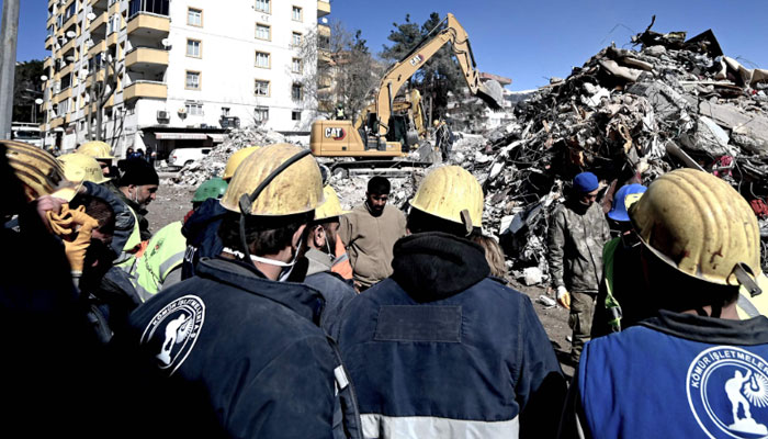 Rescue team miners gather after they rescued Aleyna Olmez, 17, from a collapsed building, 248 hours after the 7.8-magnitude earthquake which struck parts of Turkey and Syria, in Kahramanmaras on February 16, 2023. — AFP