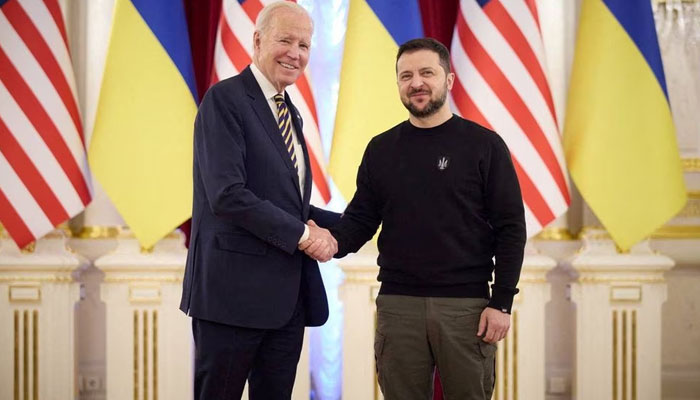 Ukraines President Volodymyr Zelenskiy and U.S. President Joe Biden shake hands before a meeting, amid Russias attack on Ukraine, in Kyiv, Ukraine February 20, 2023. — Reuters