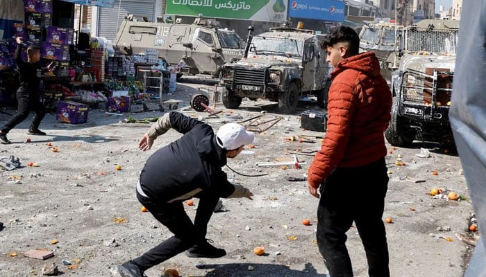 Palestinians clash with Israeli forces during a raid in Nablus in the Israeli-occupied West Bank on February 22, 2023.— Reuters