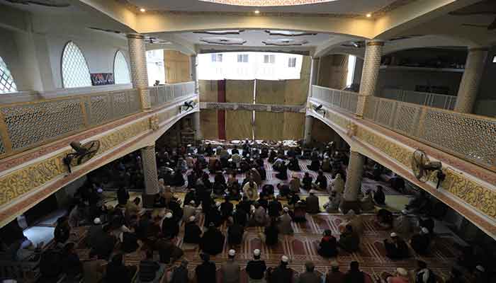 People pray for the victims who were martyred in a bombing in January, in a mosque that was partially damaged during the attack in the Police Lines area, Peshawar, February 9, 2023. — Reuters