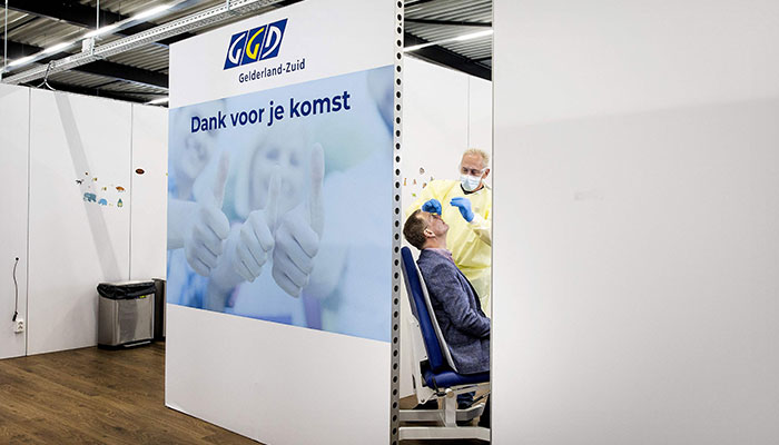 The last Covid test is taken from a person in a Covid testing centre in Tiel, on March 17, 2023 before it closes. Now that large-scale testing for Covid is no longer deemed to have added value, the Public Health service test lanes are closing. —AFP