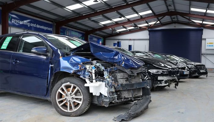 Damaged electric vehicles that have been written off by insurers are pictured at UK salvage company Synetiqs yard in Doncaster, Britain. — Reuters/File