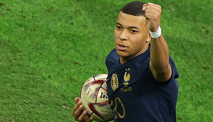 In this file photo taken on December 18, 2022 France´s forward #10 Kylian Mbappe celebrates scoring his team´s first goal from the penalty spot during the Qatar 2022 World Cup football final match between Argentina and France at Lusail Stadium in Lusail, north of Doha. AFP