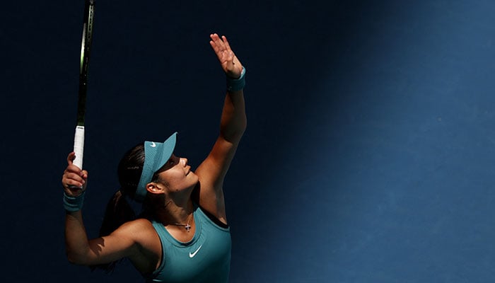 Emma Raducanu of Great Britain serves against Bianca Andreescu of Canada in their first round match during the Miami Open at Hard Rock Stadium on March 22, 2023 in Miami Gardens, Florida. AFP
