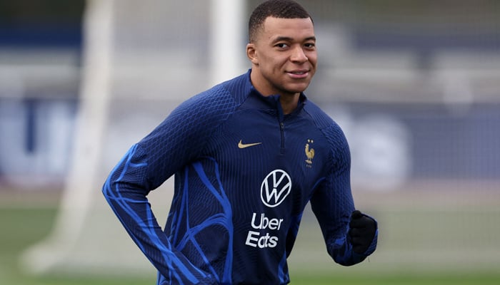 Frances forward and captain Kylian Mbappe runs during a training session in Clairefontaine-en-Yvelines on March 21, 2023, as part of the teams preparation for upcoming UEFA Euro 2024 football tournament qualifying matches. — AFP