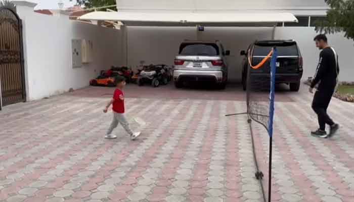 An undated image of Pakistan cricketer Shoaib Malik playing badminton with his son Izhaan Mirza-Malik. — Instagram/@realshoaibmalik