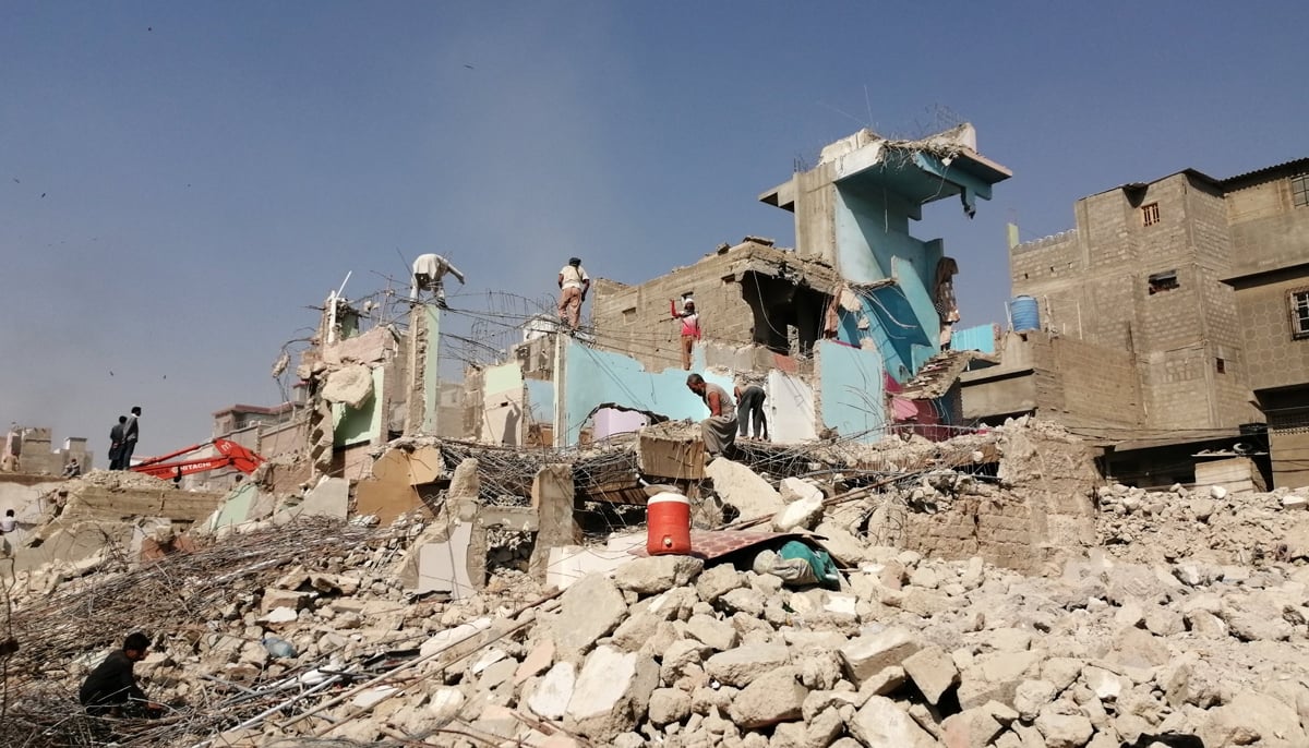 An informal settlement in Karachi being demolished. &mdash; Photo by author