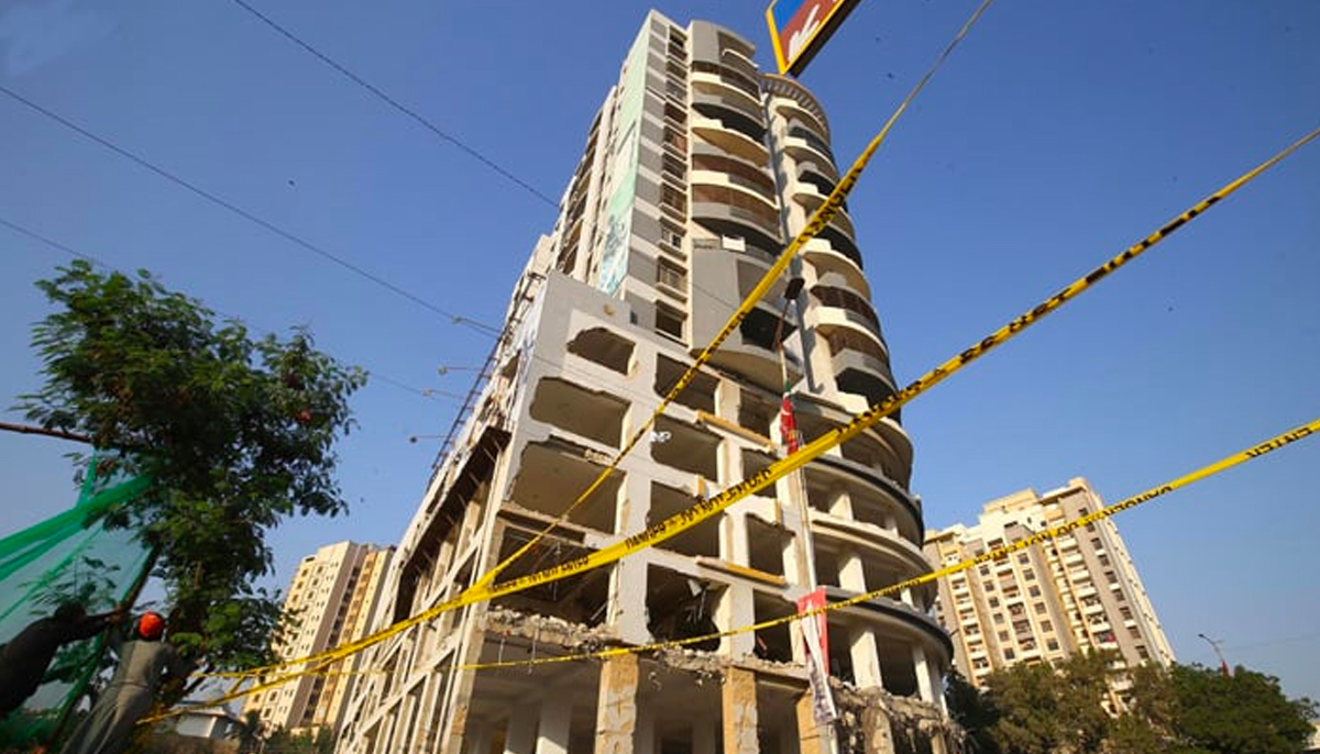 The 15-storey-high Nasla Tower in the process of being demolished. &mdash; INP