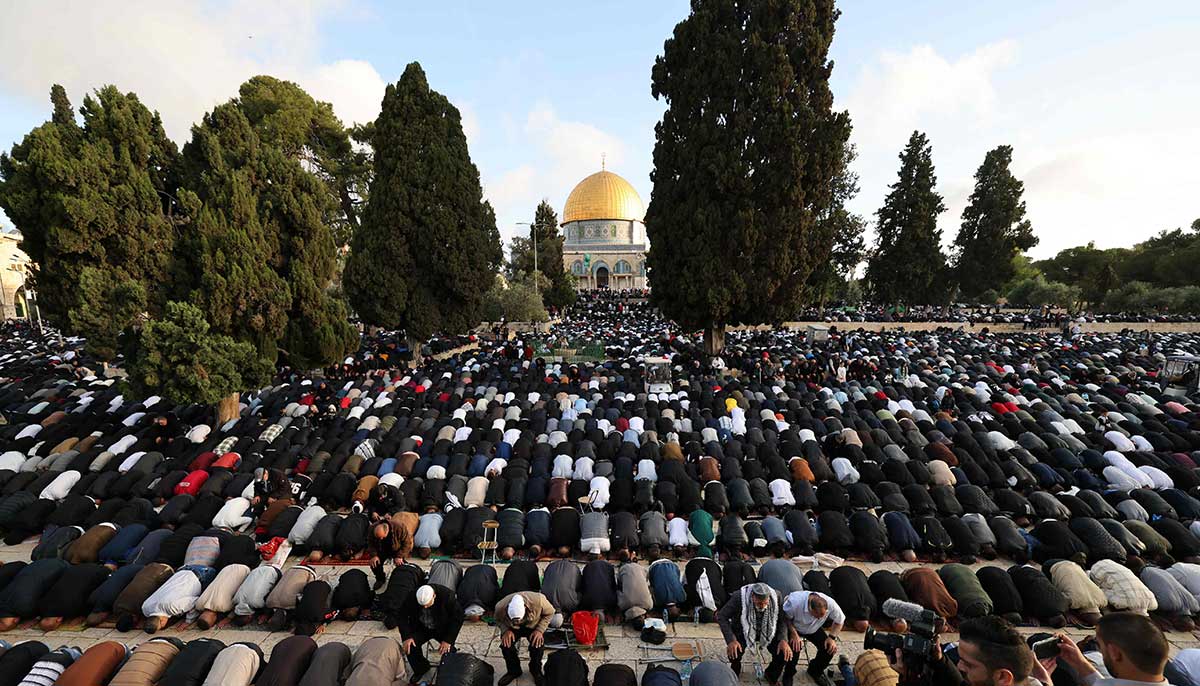 People perform the morning prayer in front of the Dome of the Rock on the first day of Eid ul Fitr in the courtyard of the Al-Aqsa mosque compound in the Old City of Jerusalem on April 21, 2023.