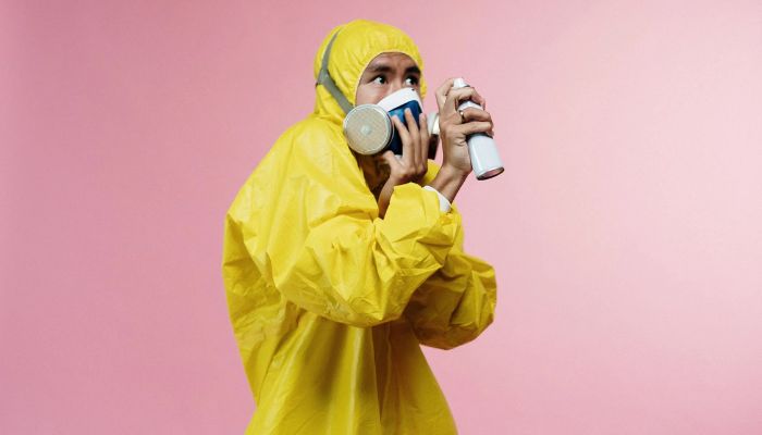 Person in yellow protective suit. — Pexels