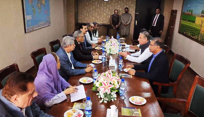 Government (left) and PTI leaders during election date talks in Islamabad, on April 28, 2023, in this still taken from a YouTube video.
