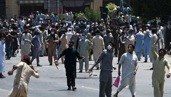 PTI activists and supporters of former prime minister Imran take part in a protest against the arrest of their leader, in Peshawar on May 10, 2023. — AFP