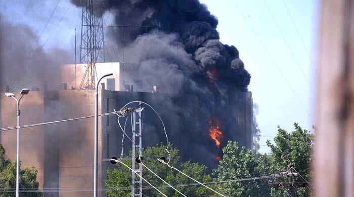History goes up in smoke as PTI protesters set Radio Pakistan Peshawar on fire
