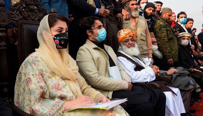 In this file photo, PML-N Senior Vice President Maryam Nawaz, PPP Chairperson Bilawal Bhutto-Zardari and JUI-F chief Maulana Fazlur Rehman attend the PDM rally in Peshawar. — AFP/File