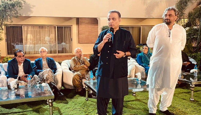 Ali Zaidi with Aleem Khan at the latters residence. — Twitter/@SHABAZGIL