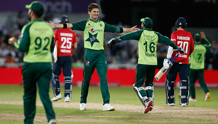 Cricket - First Twenty20 International - England v Pakistan - Trent Bridge, Nottingham, Britain - July 16, 2021 Pakistans Shaheen Afridi celebrates with teammates after taking the wicket of Englands Matt Parkinson to win the match. — Reuters