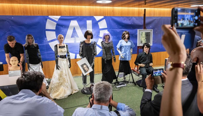Robotics can be as they pose for a picture for Good Global Summit in Geneva, on July 7, 2023. — AFP