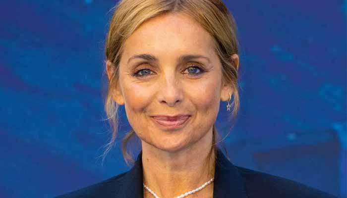 Louise Redknapp cut a glamorous figure in a matching black blazer and skirt paired with a Prada camisole