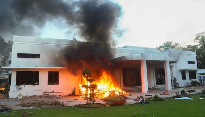 A view of a house in the cantonment area, which was set afire by supporters of former prime minister Imran Khan during a protest against his arrest, in Lahore, May 9, 2023. — Reuters