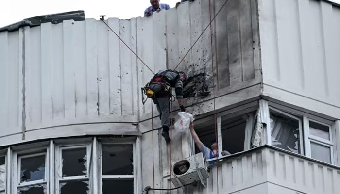 The damaged facade of an apartment building after reported drone attacks in Moscow in May. — AFP
