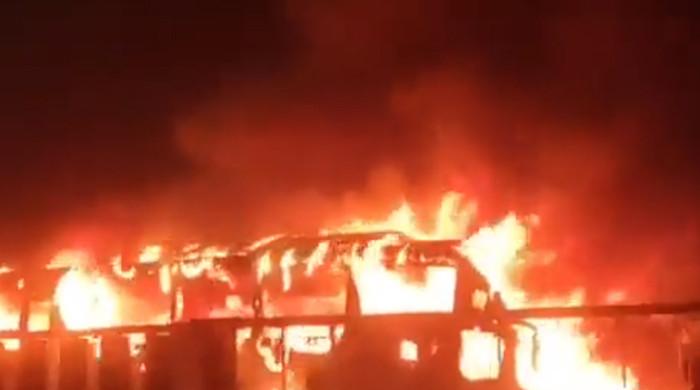18 killed, 15 injured as passenger bus catches fire near Pindi Bhattian