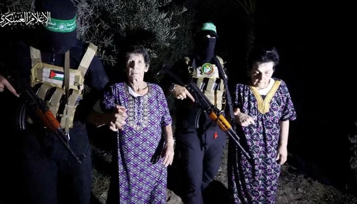 Yocheved Lifshitz and Nurit Cooper (also known as Nurit Yitzhak) who were held hostages by Palestinian Hamas militants, are released by the militants. via Al-Qassam Brigades, the military wing of Hamas.—Reuters