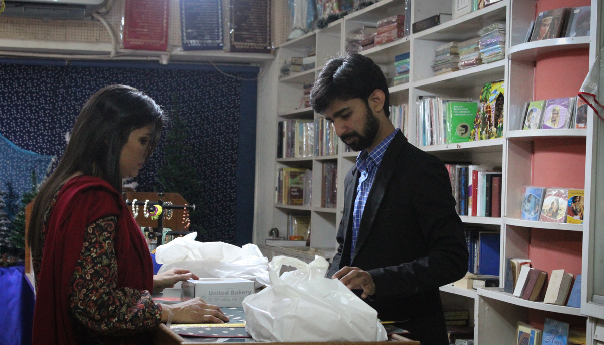 Jerome John attends to a customer at the store. — Photo by author