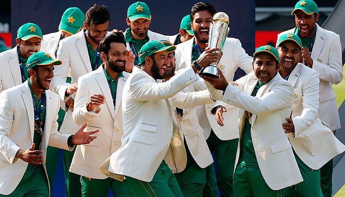 Sarfraz Ahmed (third right) lifts the trophy as Pakistan players celebrate their win at the presentation after the ICC Champions Trophy final cricket match between India and Pakistan at The Oval in London. — AFP/File