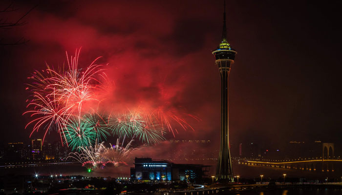 Fireworks explode near the Macau Tower marking the last day of the Chinese New Year festivities in the Lunar calendar, in Macau on February 5, 2023. — AFP