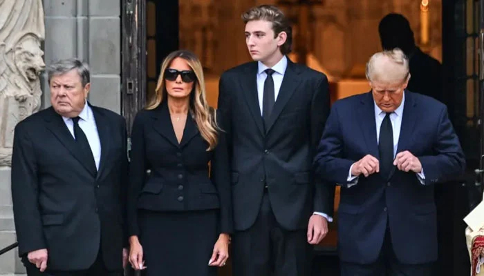 Melania Trump, who eagle-eyes Barron Trump (C-R), is scared of letting him out of sight. — AFP/File