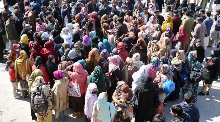 Why is a long march planned to Muzaffarad on May 11?