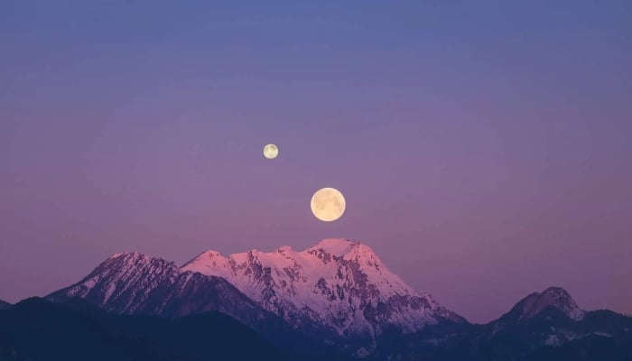 The Moon can be seen accompanied by a smaller moon in this illustrative image. —Orbital Today website