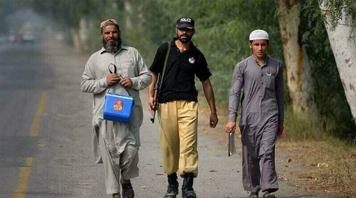 Terrorists martyr two cops guarding polio vaccinators in KP