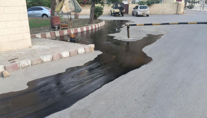 Oil leaked from a damaged pipeline seen spilled on a road on December 1, 2024. — Reporter