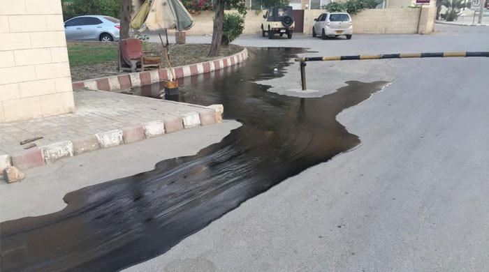 Oil from damaged refinery pipeline spills on road near Sea View