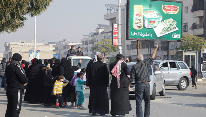 People gather after rebels led by HTS have sought to capitalise on their swift takeover of Aleppo in the north and Hama in west-central Syria by pressing onwards to Homs, in Hama, Syria December 6, 2024. — Reuters