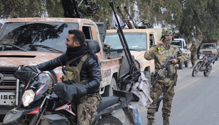 A rebel fighter gestures in Homs countryside, after Syrian rebels pressed their lightning advance on Saturday in Syria December 7, 2024. — Reuters